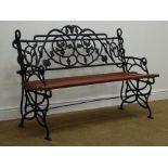 Ornate cast iron garden bench, painted black finish with hardwood seat slats,