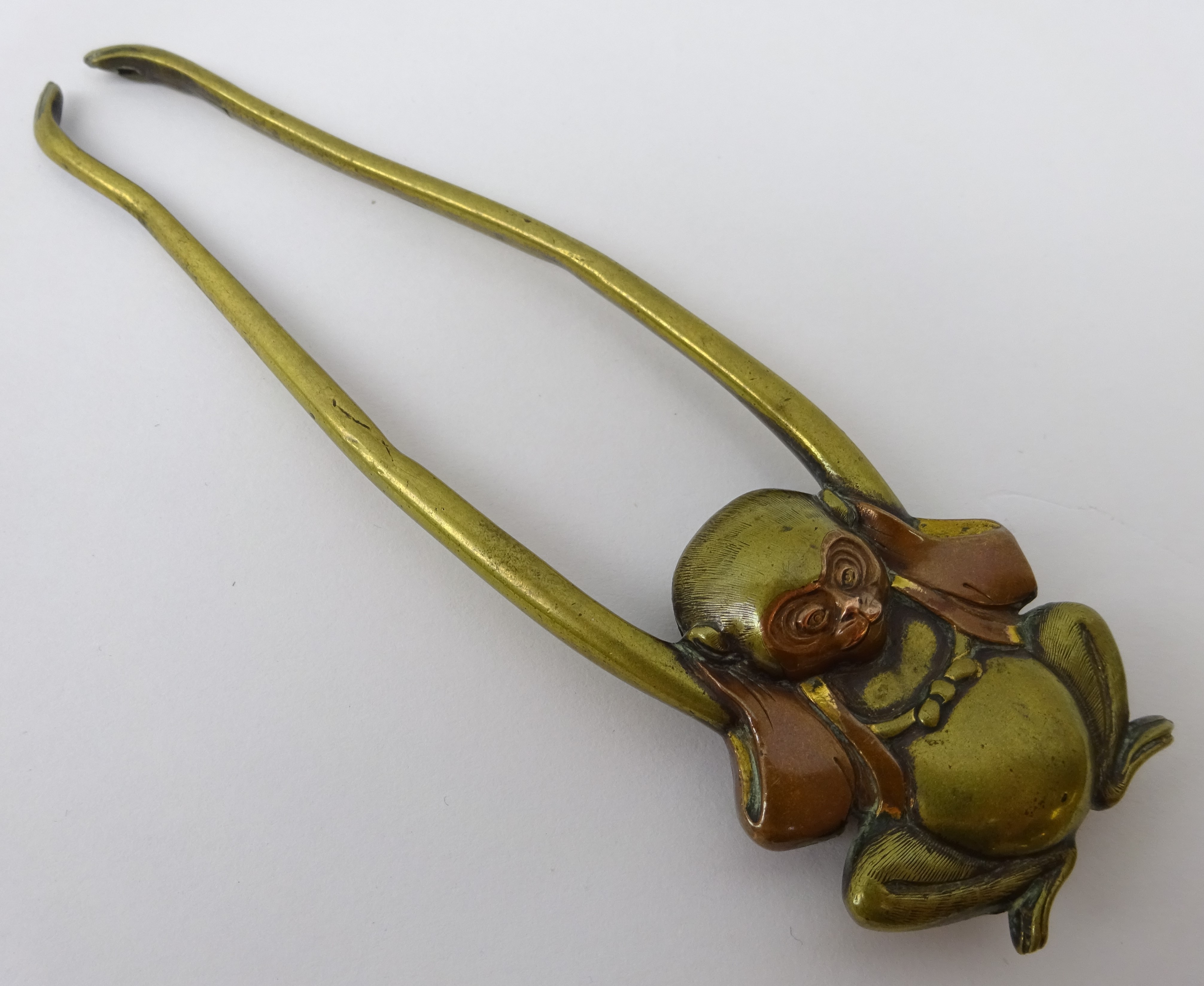 19th century Japanese bronze Sashi type netsuke modelled as a Monkey with elongated arms with