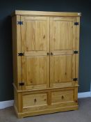 Corona pine double wardrobe, two doors enclosing hanging rail above two drawers, shaped plinth base,