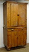 Early 20th century stained and grained pine kitchen cabinet, projecting cornice,