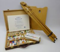 Winsor & Newton picture easel, Artists paint box containing various oils, some unopened,