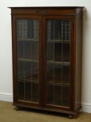 Early 20th century oak bookcase, two lead glazed doors enclosing four shelves,