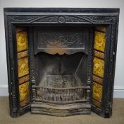 Victorian ornate cast iron fireplace with treacle glazed tiles depicting fruits and flowers, W92cm,