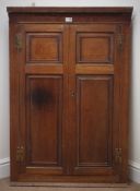 George III inlaid oak barrel back corner cupboard, dentil frieze,