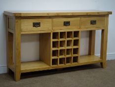 Light oak sideboard, three drawers, square supports joined by an undertier with wine rack, W150cm,