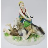 Meissen model of a Goatherd and his lass on a rocky outcrop, blue cross swords mark to base no.