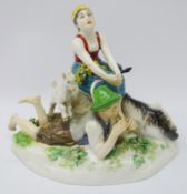 Meissen model of a Goatherd and his lass on a rocky outcrop, blue cross swords mark to base no.