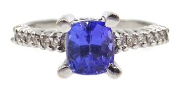 18ct white gold emerald cut tanzanite, with diamond set shoulders,