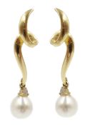 Pair of 14ct gold pearl and diamond swirl pendant earrings,