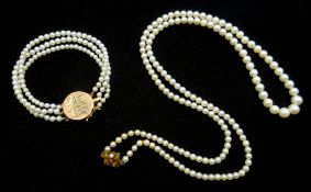 Chinese three strand pearl bracelet on gold clasp with chinese characters stamped 14k and a Chinese