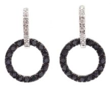 Pair of 18ct white gold black and white circular diamond earrings,
