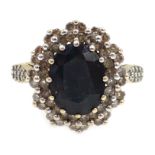 Gold sapphire and diamond cluster ring, with diamond set shoulders,