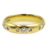 18ct yellow gold band set with nine trilogy diamonds, hallmarked Condition Report 6.