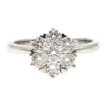 White gold seven stone diamond flower cluster ring, hallmarked 18ct,