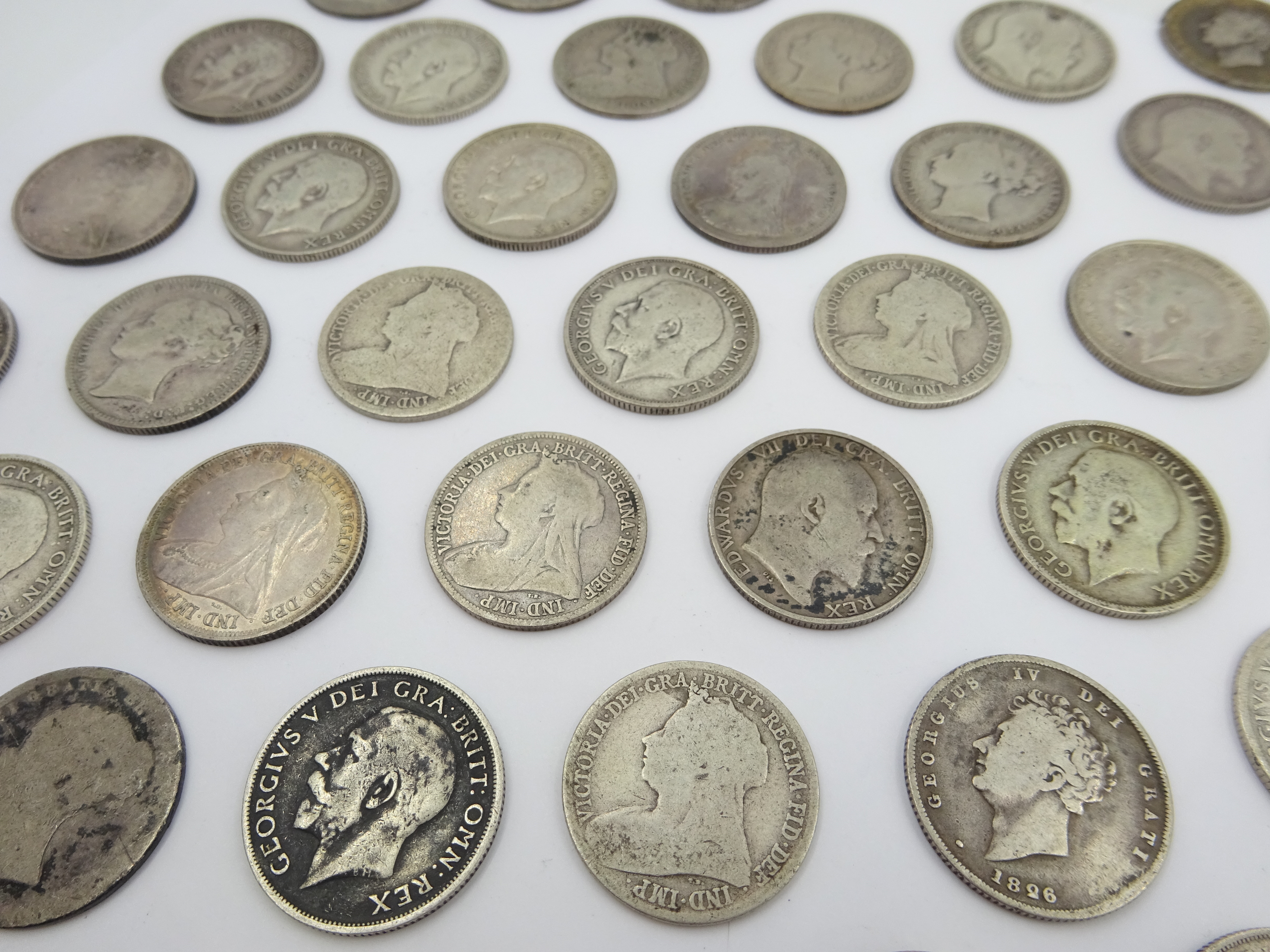 Sixty-nine pre 1920 British silver one shilling coins including; 1819, three 1826, 1871, 1872, 1873, - Image 7 of 8