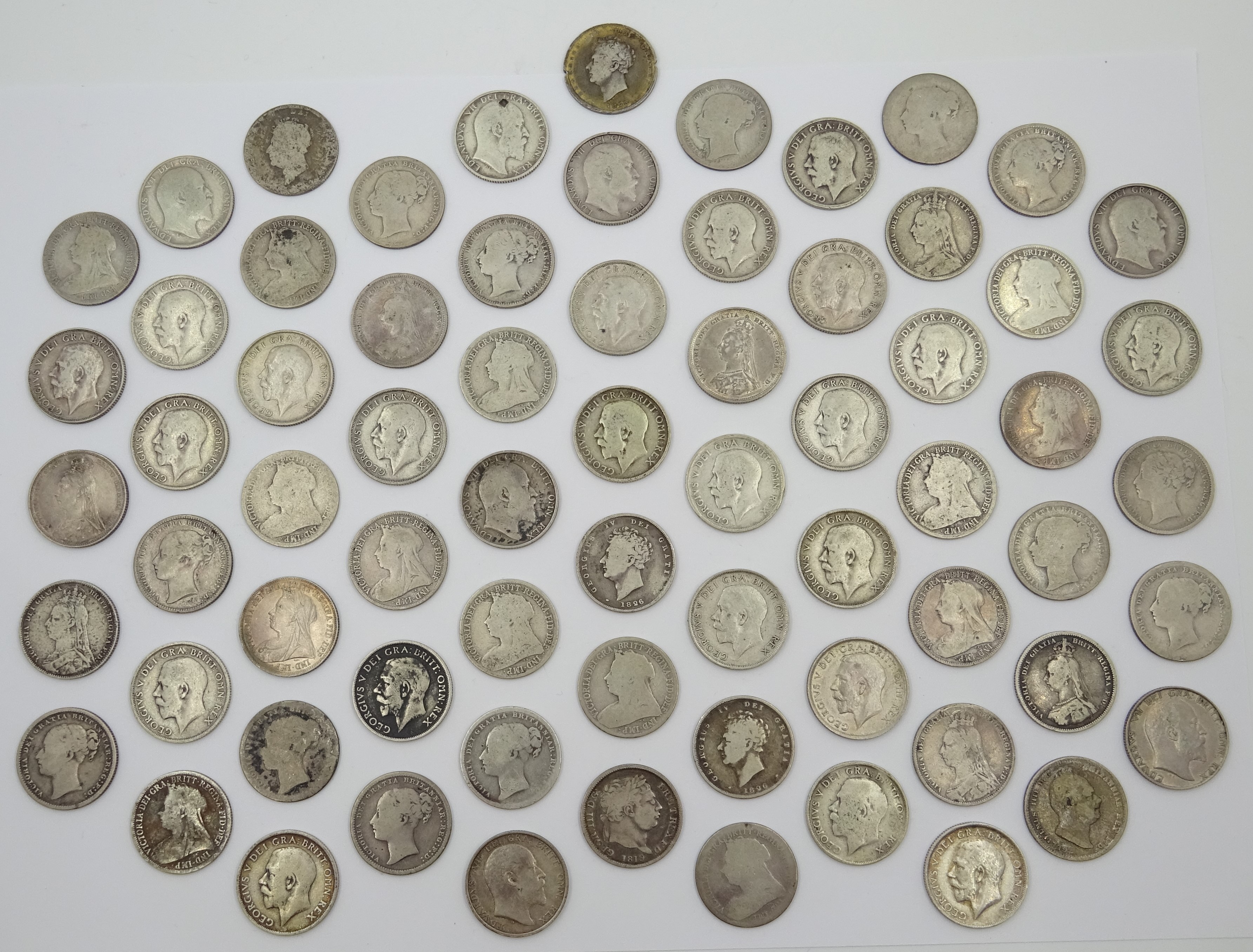 Sixty-nine pre 1920 British silver one shilling coins including; 1819, three 1826, 1871, 1872, 1873,