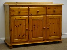 Pine dresser, raised back, three drawers above three cupboard doors, bun feet, W118cm, H87cm,