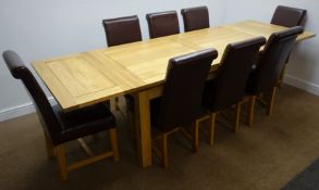 Light oak extending dining table, square supports (W280cm, H79cm, D90cm) and eight high back chairs,
