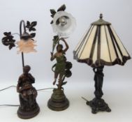 Tiffany style figural table lamp, leaded glass shade on cast metal base, H62cm,