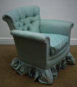 Early 20th century upholstered armchair, with buttoned back and loose seat cushion on cabriole legs,