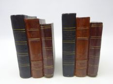 Two bookends in the form of leather bound books,