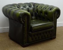 Chesterfield club armchair, upholstered in deep buttoned green leather,