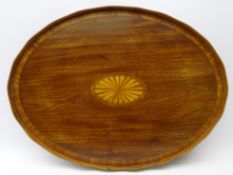 19th century oval mahogany cross banded tea tray, waved gallery and central stylized shell inlay,