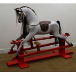 Mid 20th century dapple grey rocking horse, horse hair mane and tail, leather bridle and saddle,