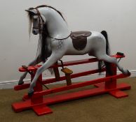 Mid 20th century dapple grey rocking horse, horse hair mane and tail, leather bridle and saddle,