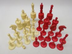 19th century Red stained bone and natural chess set, lacks white bishop, H11.