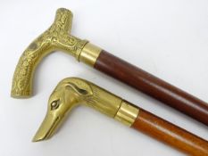 Three section walking stick with Greyhound cast brass handle and integral spirit flask and another