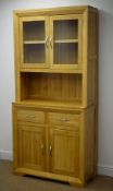 Light oak dresser, two glazed doors enclosing single shelf above two drawers and two cupboard doors,