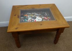 Collection of novelty lighters including Marlboro in glass topped pine display table, W76cm, D48cm,