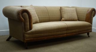 Three seat sofa, scrolled arms, upholstered in check fabric and tan leather,