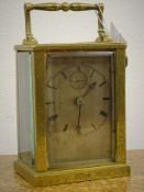 Victorian brass carriage timepiece, allover scroll chased case with bevelled glass panels,