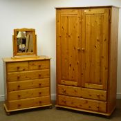 Pine double wardrobe, two panelled doors enclosing fitted interior, above two drawers,