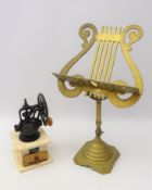 Brass lyre shaped tabletop music stand and a coffee grinder