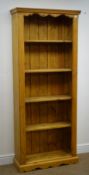 Solid pine open bookcase, projecting cornice, four shelves, shaped plinth base, W76cm, H183cm,