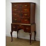 Mid 20th century walnut chest on stand, moulded top, seven graduating drawers,