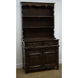 Early 20th century oak dresser, twin shelf back, two drawers above two linenfold carved doors,