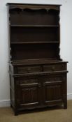 Early 20th century oak dresser, twin shelf back, two drawers above two linenfold carved doors,
