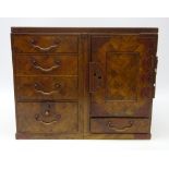 Japanese Meiji period parquetry table top cabinet, four black lacquer lined graduated drawers,