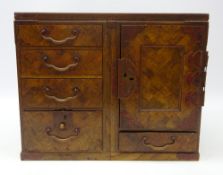 Japanese Meiji period parquetry table top cabinet, four black lacquer lined graduated drawers,