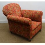 Early 20th century armchair, upholstered in a red and green geometric patterned fabric,