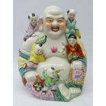 20th century Chinese ceramic model of Budai laughing and surrounded by adoring youngsters,