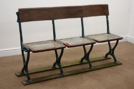 Early 20th century cast iron framed folding cinema seats, rush splat and seat, W152cm, H86cm,