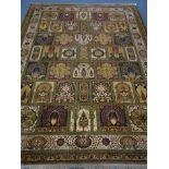 Keshan ochre ground rug, panelled pattern field with peacocks and stylised eastern motifs,