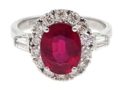 18ct white gold ruby and diamond cluster ring, with tapering baguette diamond shoulders,