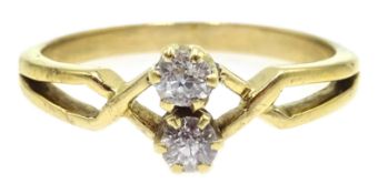 Gold two stone diamond crossover ring, stamped 18 Condition Report size N 2.