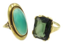Two gold green stone set rings,